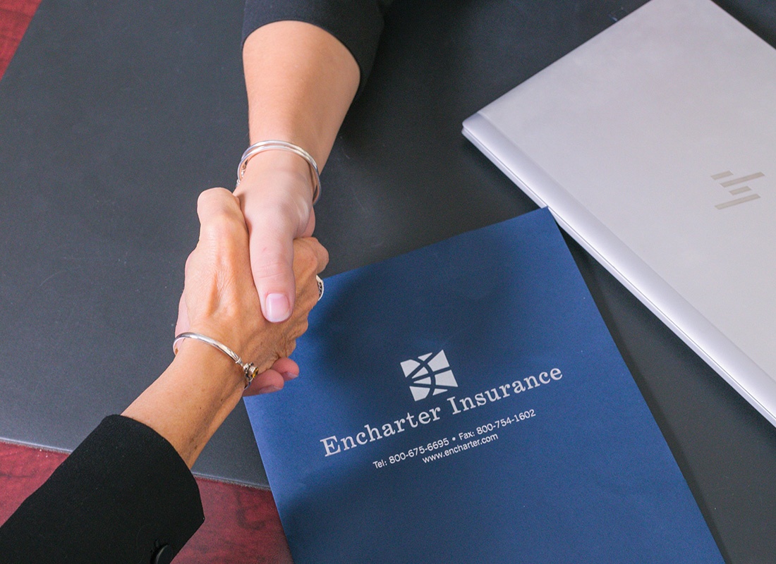 Insurance Solutions - Overhead View of Two Woman Shaking Hands