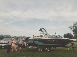 Employee Spotlight: Christine Fleury with family and boat