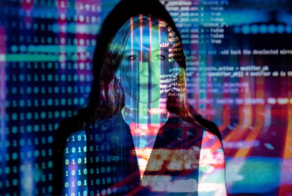 Woman as seen through computer screens.